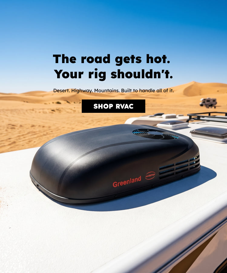 A Greenland inverter RV AC unit and solar panels mounted on an RV roof with a desert backdrop.