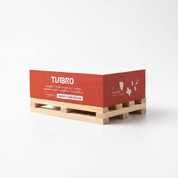 Wooden pallet with a red Turbo branded box on a white background,view 1